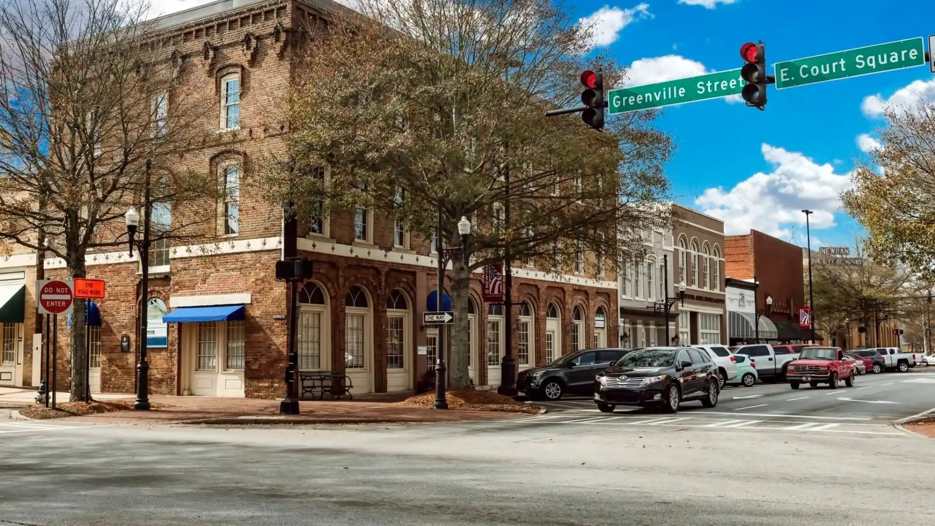 Historic brick storefronts at Greenville Street and East Court Square in downtown Newnan, GA