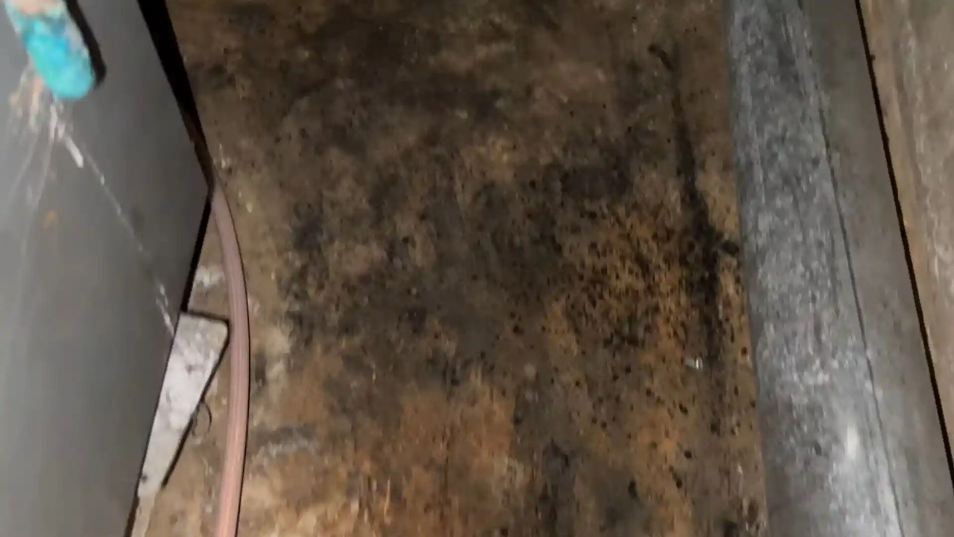 Oily black soot residue coating a surface after an oil furnace puffback